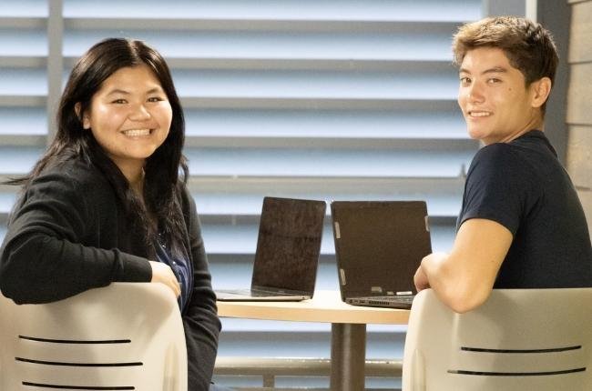 students working on laptop